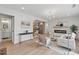 Spacious open-concept living area featuring a dining space and fireplace at 2244 Alpha Dr, Decatur, GA 30032