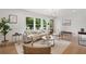 Bright, open living room featuring stylish decor and hardwood floors at 2244 Alpha Dr, Decatur, GA 30032