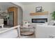 Bright living room with modern fireplace, wood floors, and open layout at 2244 Alpha Dr, Decatur, GA 30032