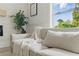 A sun-drenched living room showcases chic, neutral furnishings at 2244 Alpha Dr, Decatur, GA 30032