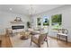 Bright living room with hardwood floors, fireplace and large windows at 2244 Alpha Dr, Decatur, GA 30032