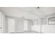 Partially finished basement with painted walls, updated fixtures and clean gray flooring at 3066 Malvern Dr, Snellville, GA 30039