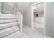 View of basement from the stairway showcases a window and wainscotting at 3066 Malvern Dr, Snellville, GA 30039
