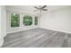 Bedroom featuring large windows overlooking beautiful greenery and great outdoor views at 3066 Malvern Dr, Snellville, GA 30039