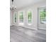 Bright dining area with hardwood floors, unique windows, and fresh, neutral paint at 3066 Malvern Dr, Snellville, GA 30039