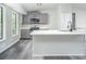 Stylish kitchen with island, stainless steel appliances, and gray cabinetry at 3066 Malvern Dr, Snellville, GA 30039