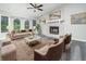 Bright living room featuring a fireplace, large windows, and neutral decor at 3066 Malvern Dr, Snellville, GA 30039