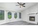 Bright living room featuring a fireplace, large windows, and neutral decor at 3066 Malvern Dr, Snellville, GA 30039