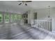 Spacious open floorplan with modern gray finishes, a kitchen island, and plentiful windows at 3066 Malvern Dr, Snellville, GA 30039