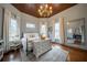 Charming bedroom features hardwood floors, a wooden ceiling, and large windows with natural light at 4527 Dallas St, Acworth, GA 30101