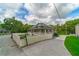 Exterior view featuring long driveway, white picket fence, manicured lawn and beautifully landscaped yard at 4527 Dallas St, Acworth, GA 30101