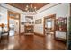 Foyer with gleaming hardwood floors, wood trim, and views into other rooms create a warm welcome at 4527 Dallas St, Acworth, GA 30101