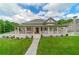 Charming home with a large wrap-around porch, walkway, well-manicured lawn and picturesque curb appeal at 4527 Dallas St, Acworth, GA 30101