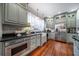 Spacious kitchen with custom cabinets, modern appliances, and window overlooking outside, creating a light-filled space at 4527 Dallas St, Acworth, GA 30101