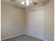 Cozy bedroom with a ceiling fan, a gray carpet, and a double door closet at 50 Carriage Trce, Stockbridge, GA 30281