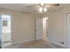 Open bedroom showcasing an ensuite bath and a closet, enhancing the home's appeal at 50 Carriage Trce, Stockbridge, GA 30281