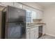 Functional kitchen featuring a stainless steel sink, granite countertops, and plenty of cabinet storage at 50 Carriage Trce, Stockbridge, GA 30281