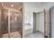 Well-appointed bathroom includes a tiled shower, soaking tub, and a stylish neutral color palette at 3006 Sea Aster Way, Buford, GA 30519