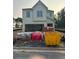 New construction home featuring a light-colored exterior, an attached garage, and construction materials at 3006 Sea Aster Way, Buford, GA 30519