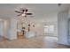 Bright, open floor plan showcasing the kitchen with island and a view to the living and dining spaces at 3006 Sea Aster Way, Buford, GA 30519