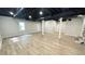 Finished basement with a painted ceiling and plenty of open space at 336 Shady Lane Cir, Canton, GA 30115
