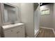 Basement bathroom with modern vanity and walk-in shower at 336 Shady Lane Cir, Canton, GA 30115