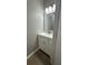Powder room with modern vanity and stylish light fixture at 336 Shady Lane Cir, Canton, GA 30115