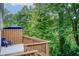 Inviting back deck with lush wooded views providing a private and serene outdoor retreat at 3999 Bayside Cir, Doraville, GA 30340