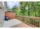 Relaxing back deck with wooded view, privacy screen, and comfortable seating for outdoor enjoyment at 3999 Bayside Cir, Doraville, GA 30340