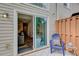 Back door access to the living room with a view of the outdoor deck and wooded surroundings at 3999 Bayside Cir, Doraville, GA 30340