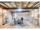 Well-lit basement with a dining area, featuring a sturdy ceiling and ample space for various activities at 3999 Bayside Cir, Doraville, GA 30340