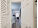 Hallway view into a bedroom and bathroom featuring modern finishes and convenient layout at 3999 Bayside Cir, Doraville, GA 30340