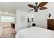 Bedroom features a ceiling fan, ensuite bathroom, and lofted office space at 3999 Bayside Cir, Doraville, GA 30340