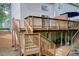 Multi-level deck offers ample space for outdoor entertaining, with stairs leading to the backyard at 3999 Bayside Cir, Doraville, GA 30340