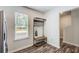 Bright dining area with coat rack, bench, and natural light streaming through a window, creating a cozy atmosphere at 3999 Bayside Cir, Doraville, GA 30340