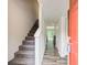 Entryway with staircase and view into the living room with deck access bringing the outside in at 3999 Bayside Cir, Doraville, GA 30340