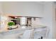 Open kitchen view with breakfast bar seating, granite countertops, and stainless steel appliances at 3999 Bayside Cir, Doraville, GA 30340
