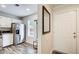 The open concept shows the kitchen and entryway with coat rack and exterior entrance at 3999 Bayside Cir, Doraville, GA 30340