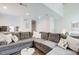 Open living space with a large sectional couch, bright lighting, and modern decor at 3999 Bayside Cir, Doraville, GA 30340