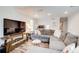 Open concept living room features a comfortable sectional and wood flooring at 3999 Bayside Cir, Doraville, GA 30340