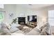 Inviting living room with fireplace, TV, and comfortable sectional sofa at 3999 Bayside Cir, Doraville, GA 30340