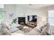 Comfortable living room with a cozy fireplace and lots of natural light at 3999 Bayside Cir, Doraville, GA 30340