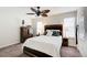 Comfortable bedroom with wooden furniture, a ceiling fan, and ample natural light from windows at 3999 Bayside Cir, Doraville, GA 30340