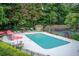 Inviting community pool and tennis court surrounded by lush greenery, perfect for recreation and relaxation at 3999 Bayside Cir, Doraville, GA 30340