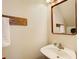 Clean powder room with pedestal sink, towel rack, and attractive mirror; a convenient space at 3999 Bayside Cir, Doraville, GA 30340