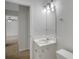 Cozy bathroom featuring a white vanity and contemporary lighting fixtures at 4009 Riverstone Dr, Suwanee, GA 30024