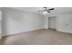 Bright bedroom with neutral walls and carpeting and closet at 4009 Riverstone Dr, Suwanee, GA 30024