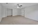 Bright bedroom with neutral walls and carpeting and closet at 4009 Riverstone Dr, Suwanee, GA 30024