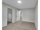 Neutral bedroom offers a minimalist aesthetic with carpeted floor, entry to walk-in closet, and recessed lighting at 4009 Riverstone Dr, Suwanee, GA 30024