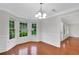 Dining area featuring a bay window for natural light and wood flooring at 4009 Riverstone Dr, Suwanee, GA 30024